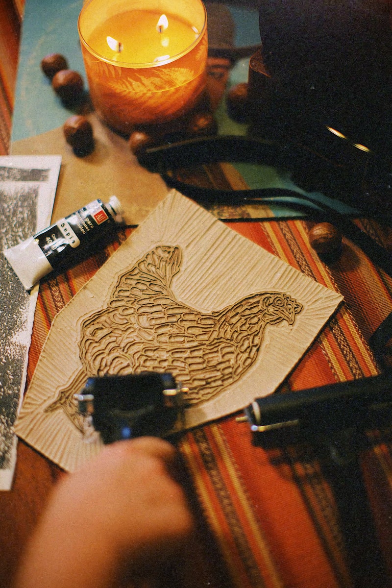 a picture of a chicken on a piece of wood